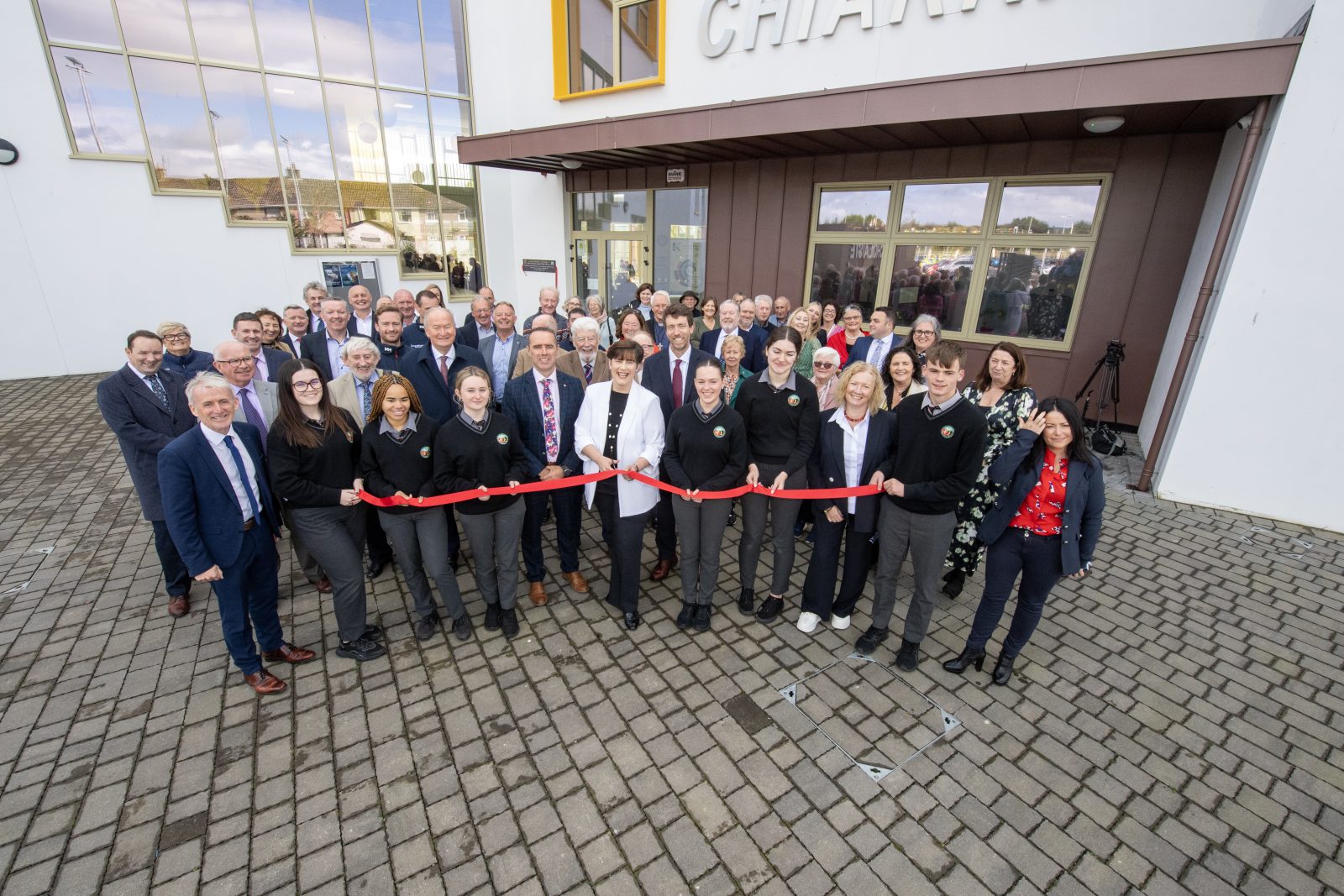 Group shot of ribbon getting cut